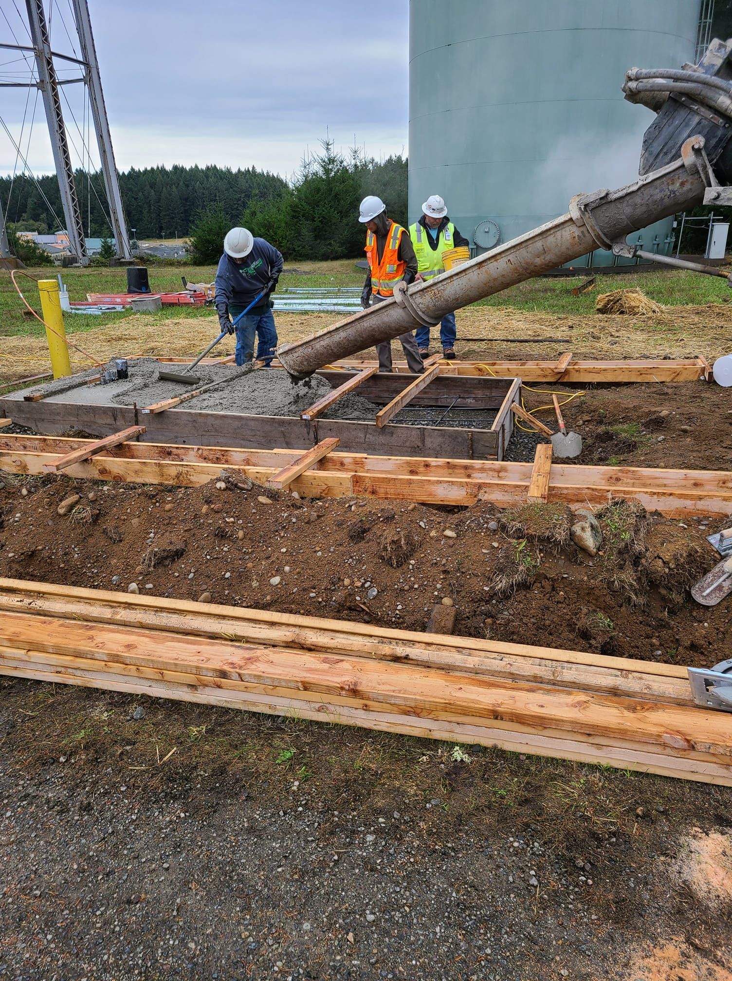 A group of construction workers are working on a construction site.