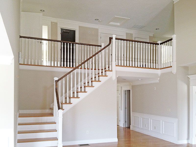 An empty house with a staircase leading to the second floor