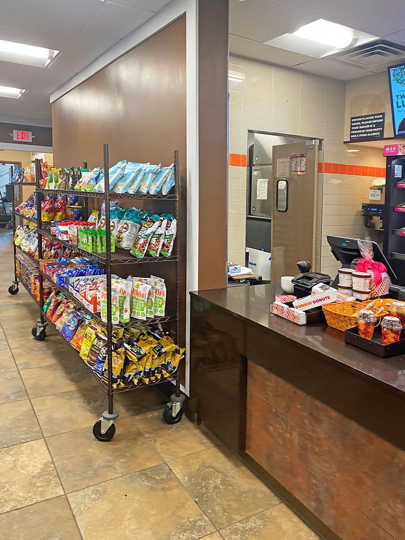 A store filled with lots of snacks and a counter.