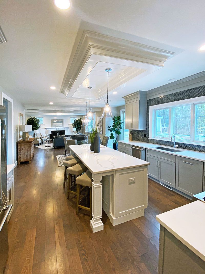 There is a large island in the middle of the kitchen.