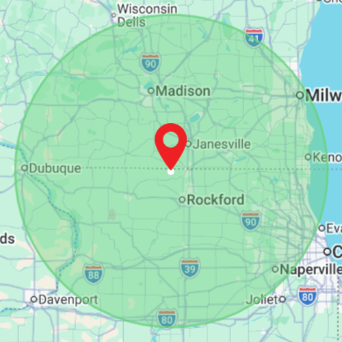 Green radius map centered on Janesville, Wisconsin, with a red location pin and nearby cities labeled.