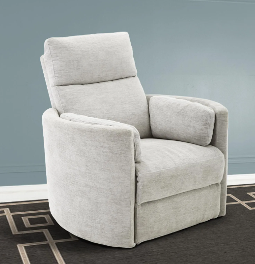 Light gray upholstered recliner chair on a dark patterned rug; blue-gray wall in the background.