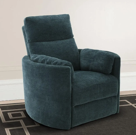 Blue recliner chair on a patterned rug, against a light wall.