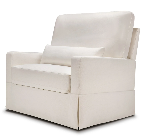 Cream-colored upholstered armchair with a lumbar pillow.