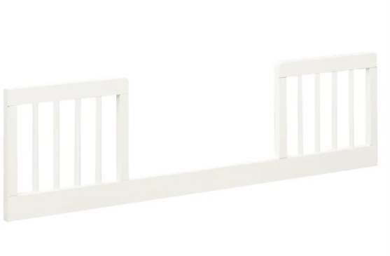 White toddler bed safety rail with vertical slats.