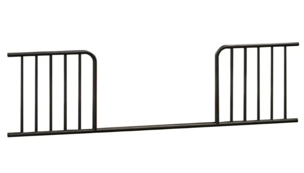 Black metal bed rail for a toddler bed.