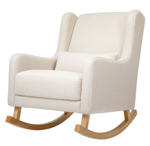 Cream-colored rocking chair with a lumbar pillow, wooden rockers, and arms.