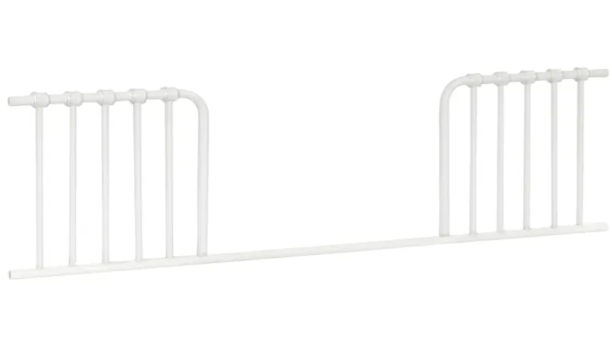 White metal toddler bed rail.