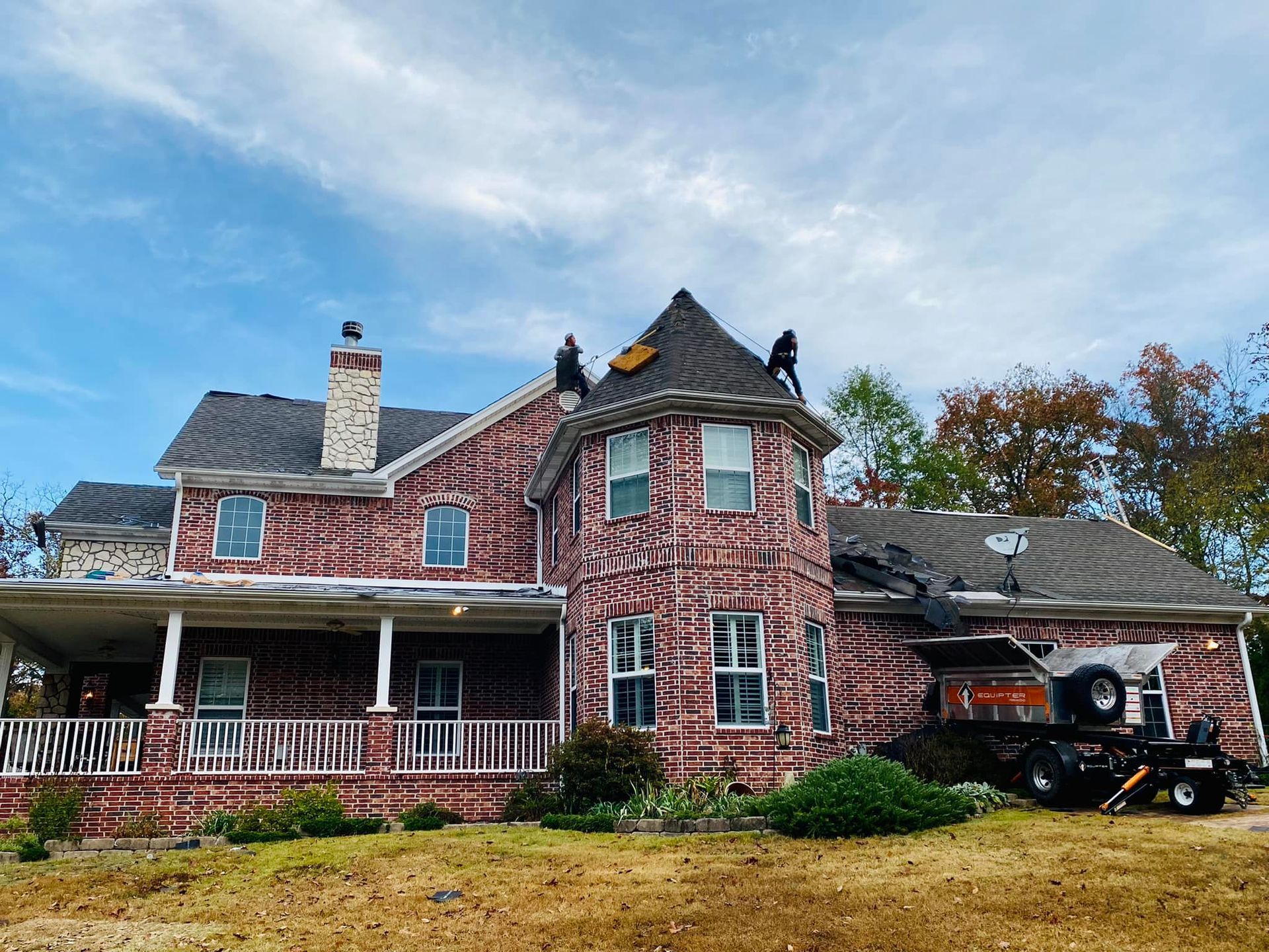 repairing the roof of a brick house