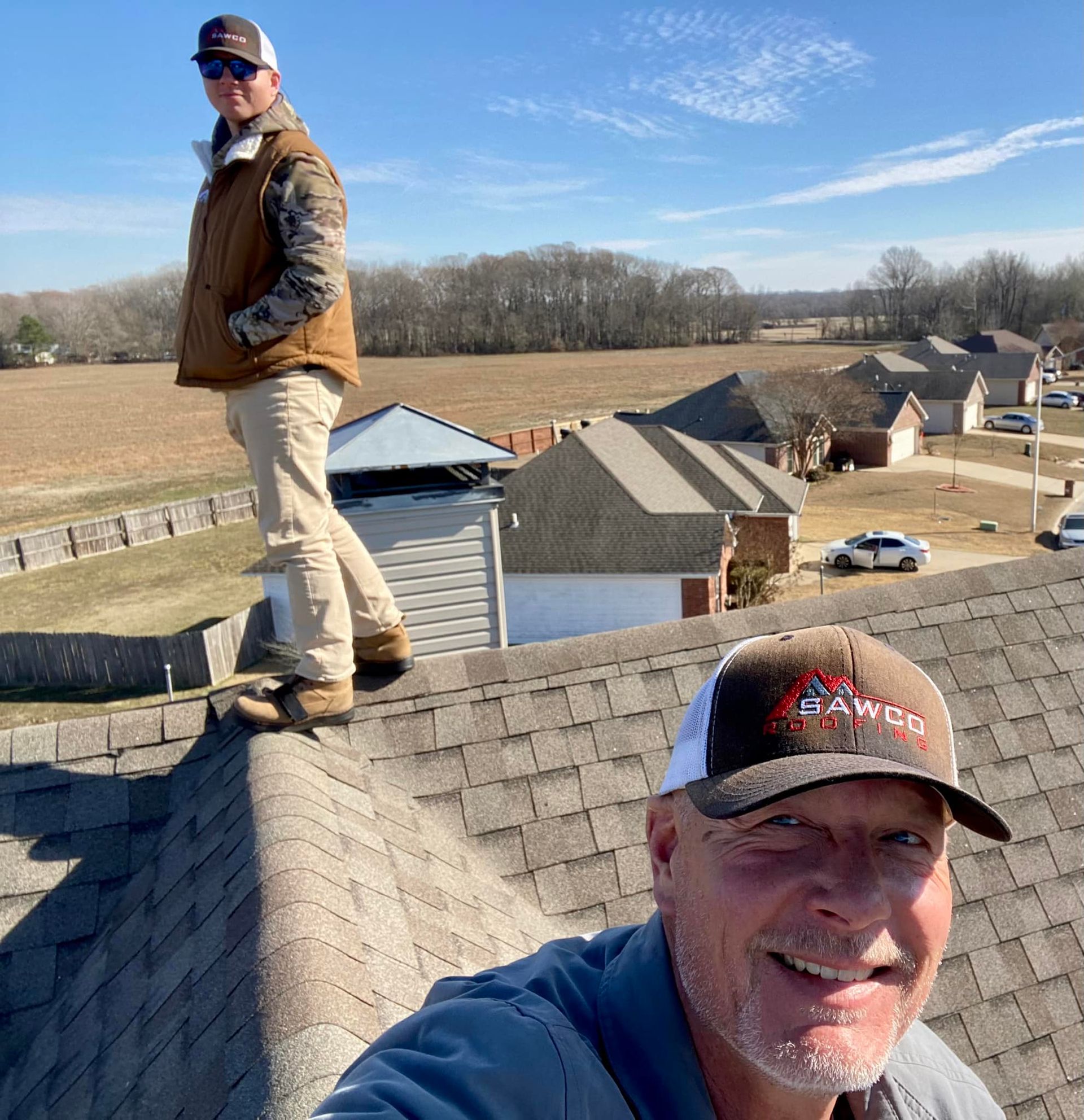 Sawco Roofing team working on the roof
