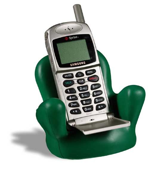 A samsung flip phone is sitting in a green chair