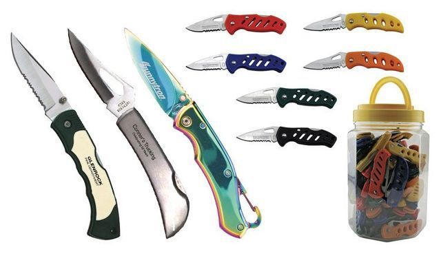 Several knives are lined up next to a jar of knives