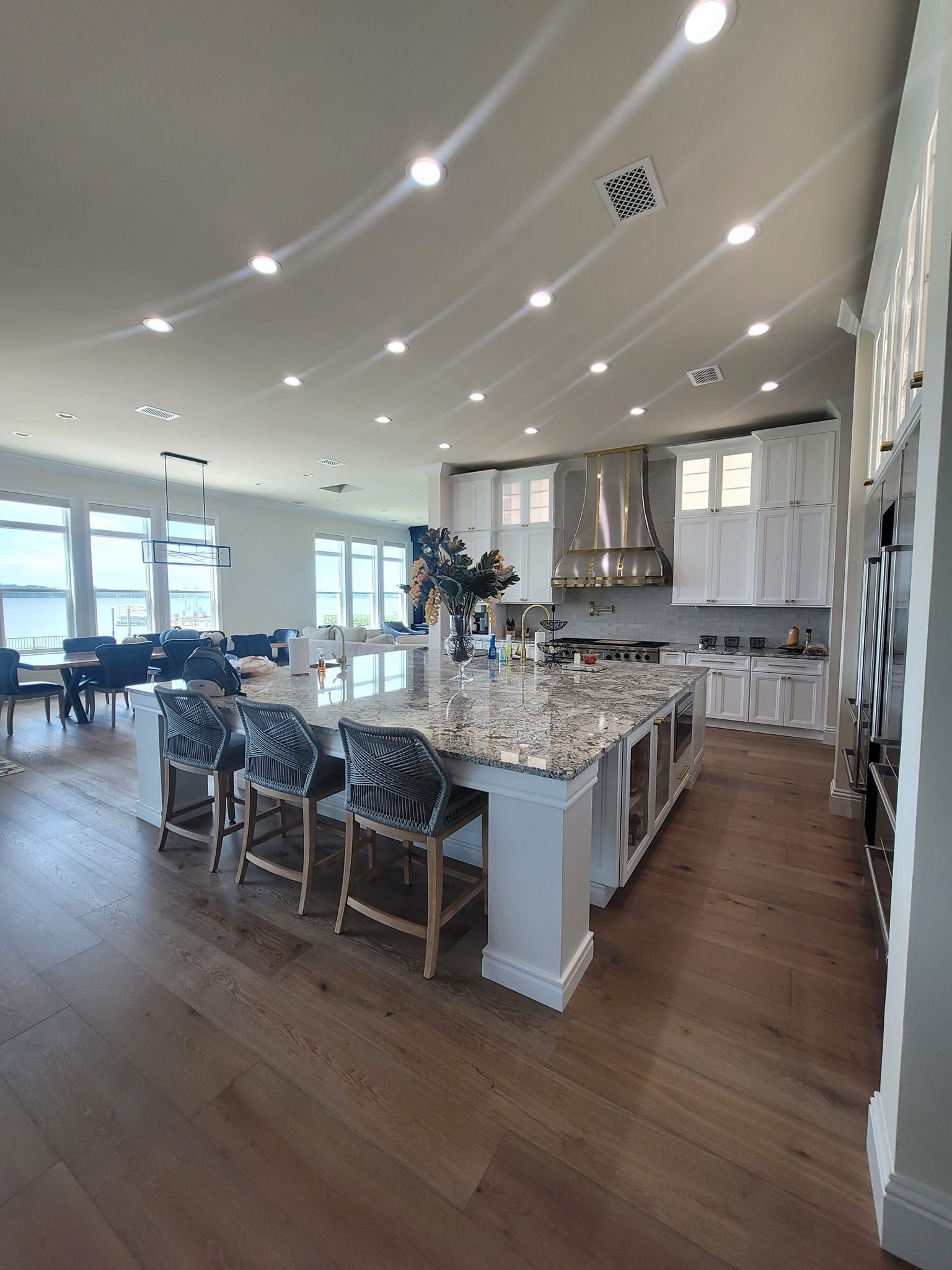 A large kitchen with a large island in the middle of the room.