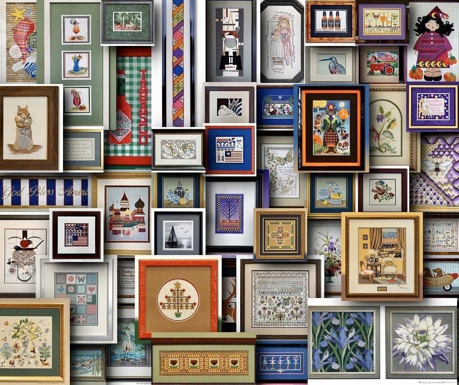 Arrangement of framed cross-stitch samplers with various designs, from landscapes to still life and characters.