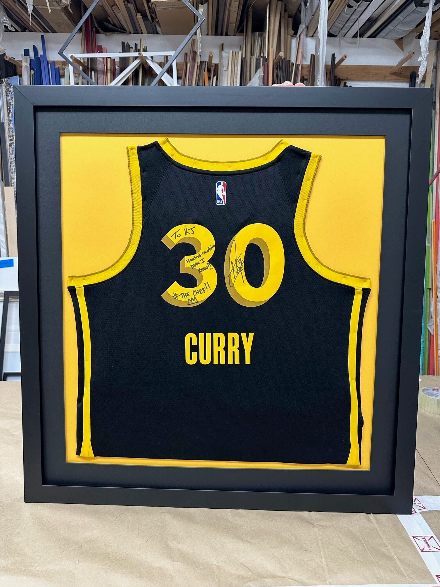 Framed black and yellow basketball jersey with 