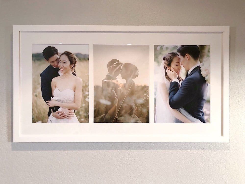 Three wedding photos in a white framed display: couple embracing in fields, kissing with golden light, and close up tender moments.