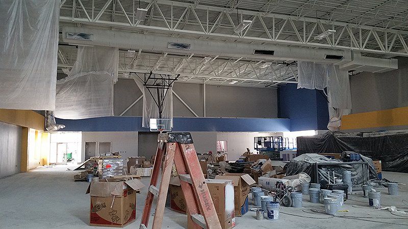 A ladder is sitting in the middle of a building under construction