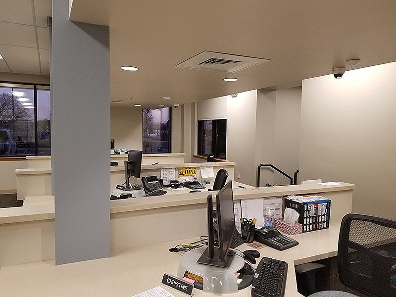 A computer is sitting on a desk in an office