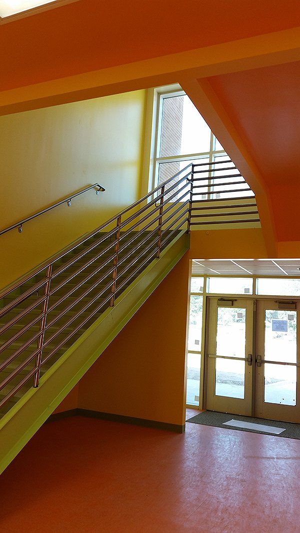 A staircase leading up to a second floor in a building