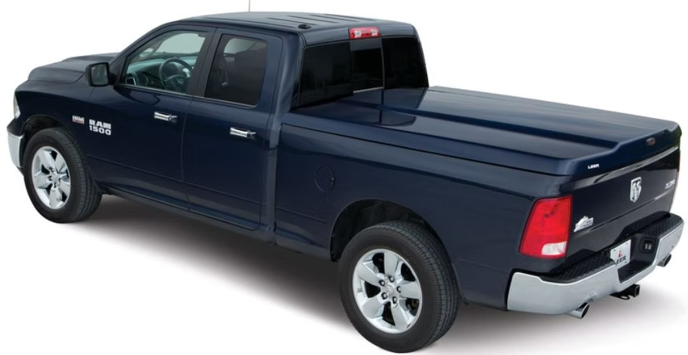 Dark blue Ram pickup truck with a tonneau cover.