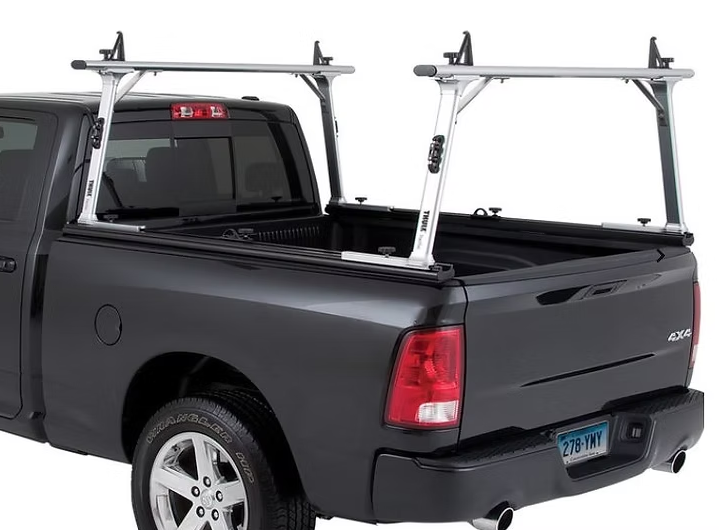Silver truck bed ladder rack on a black pickup truck.