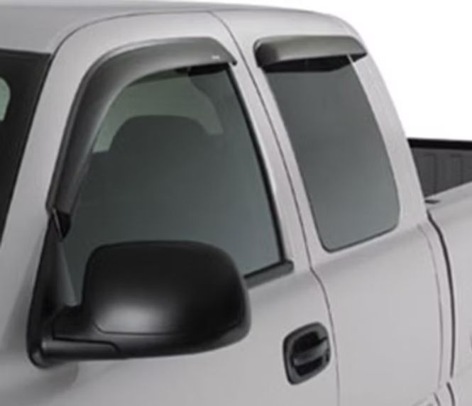 Silver pickup truck with window visors, side mirror, and closed tinted windows.