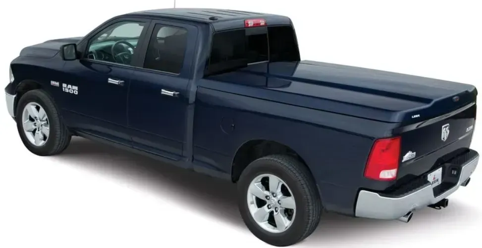 Blue Dodge Ram pickup truck with a tonneau cover.