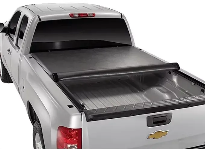 Silver pickup truck with a black retractable tonneau cover.