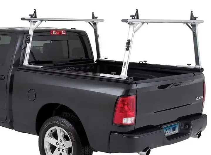 Silver truck bed rack on the back of a black pickup truck.