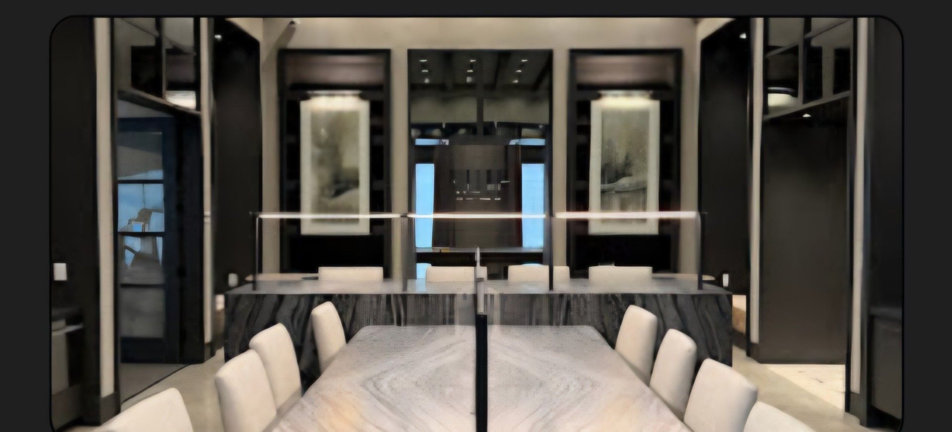 A conference room with a long table and chairs