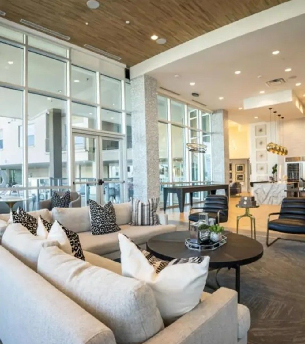 A living room with a couch and a table