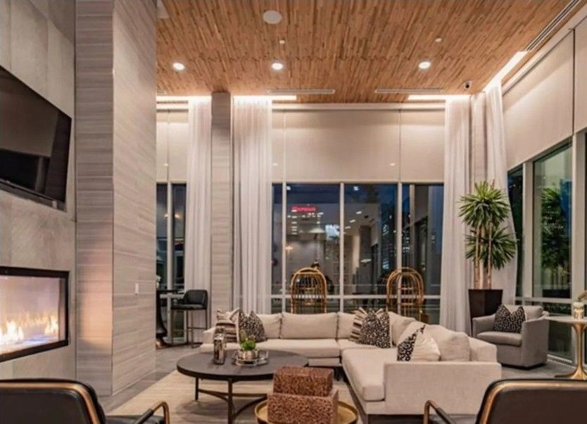 A living room filled with furniture and a fireplace.