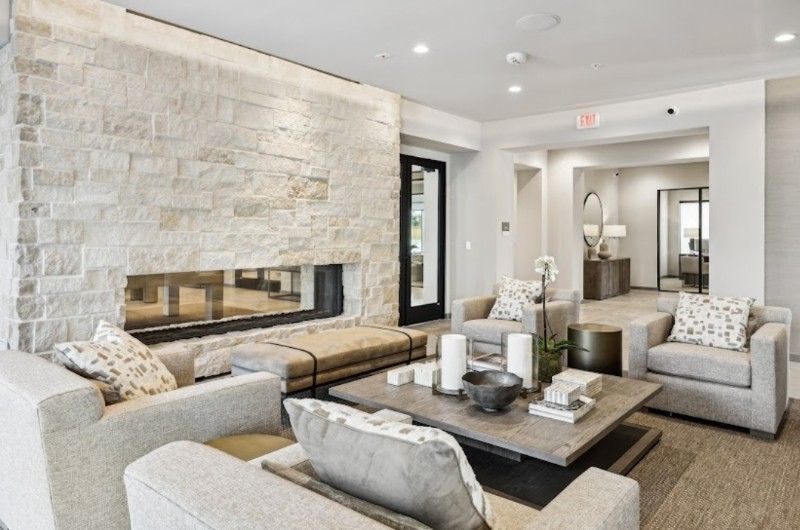 A living room filled with furniture and a fireplace.