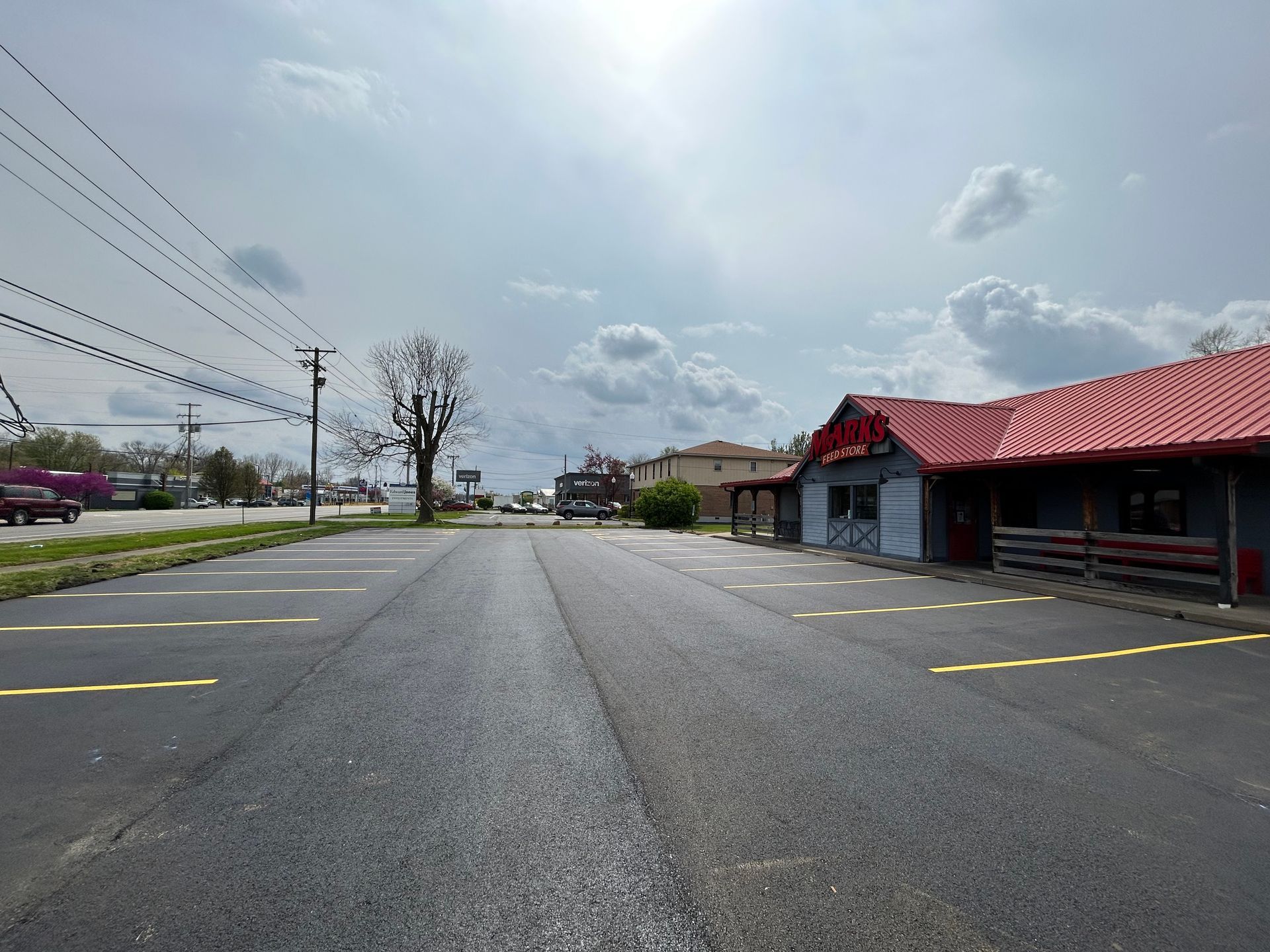 A road with a red roof and a building in the background