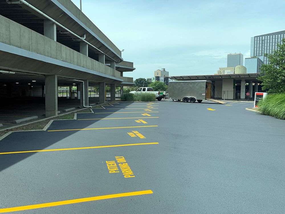 A parking lot with a yellow line that says parking only