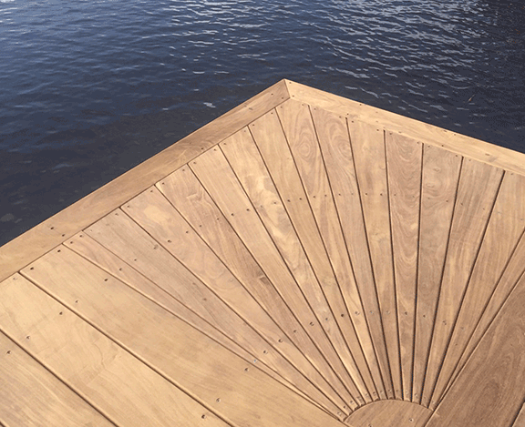 A wooden deck overlooking a body of water