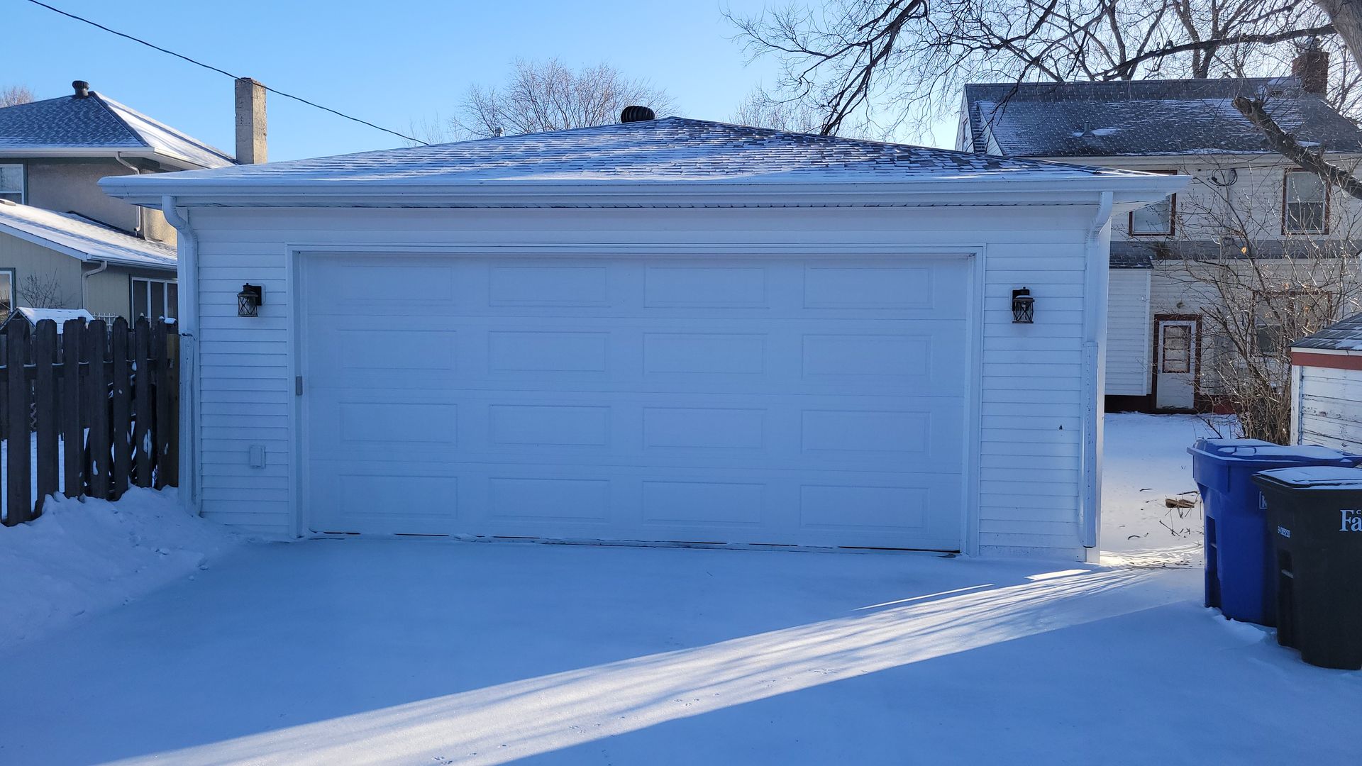 White-colored garage covered in snow