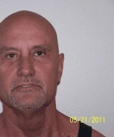 Man with bald head and goatee, looking forward. Dated May 21, 2011.