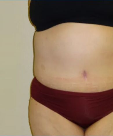 Torso of a person wearing a black bra and burgundy underwear, on a beige background.