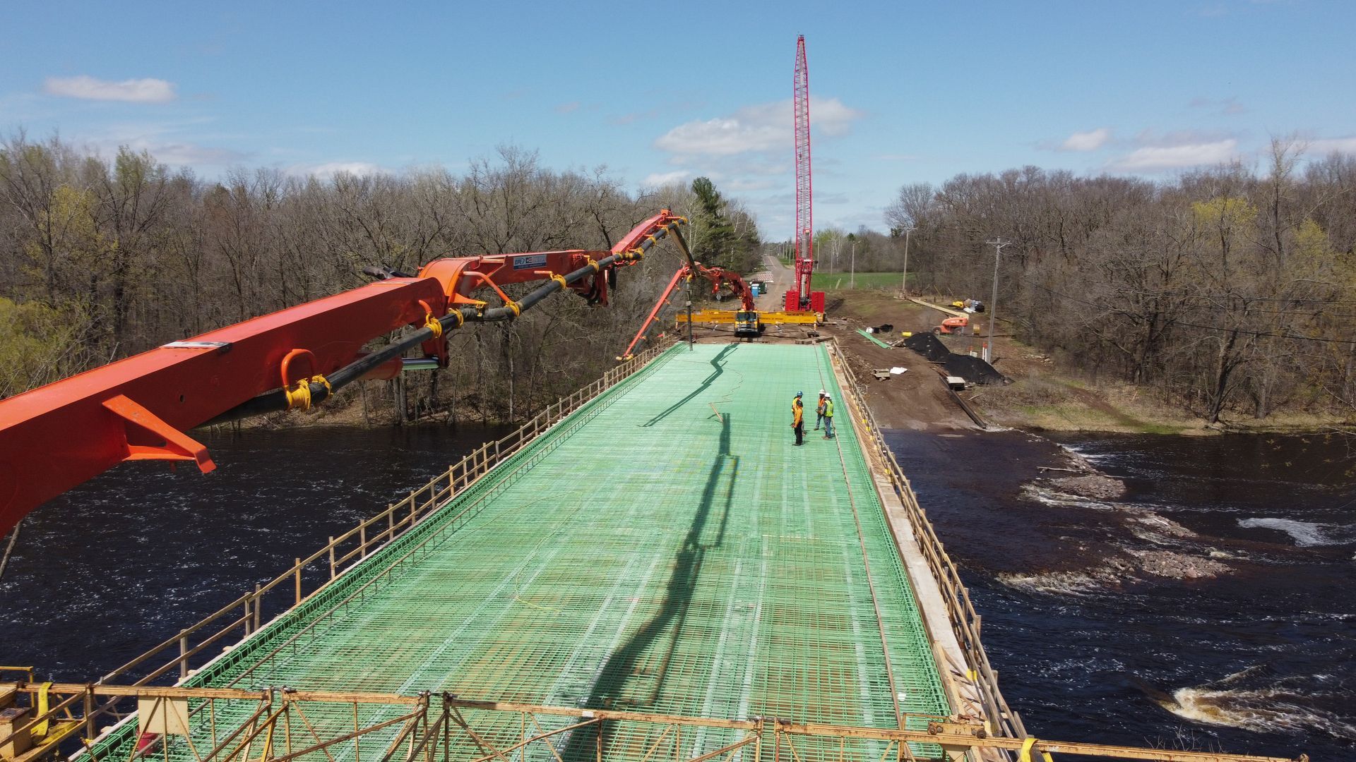 A bridge is being built over a body of water.