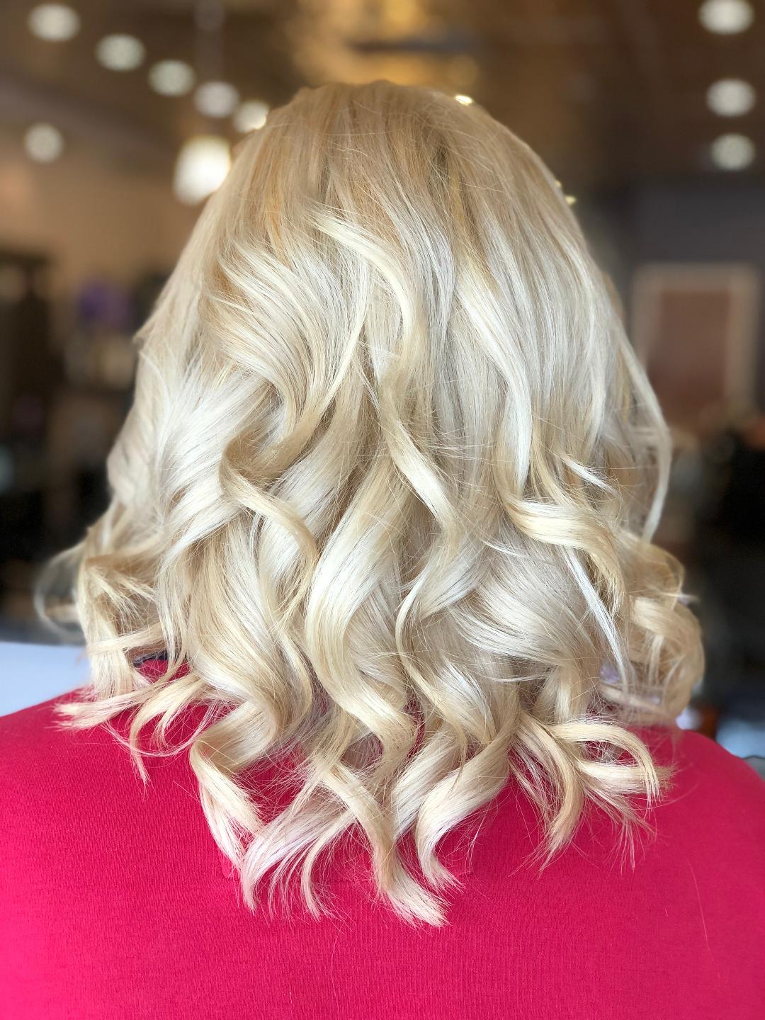 Blonde hair mid-length styled