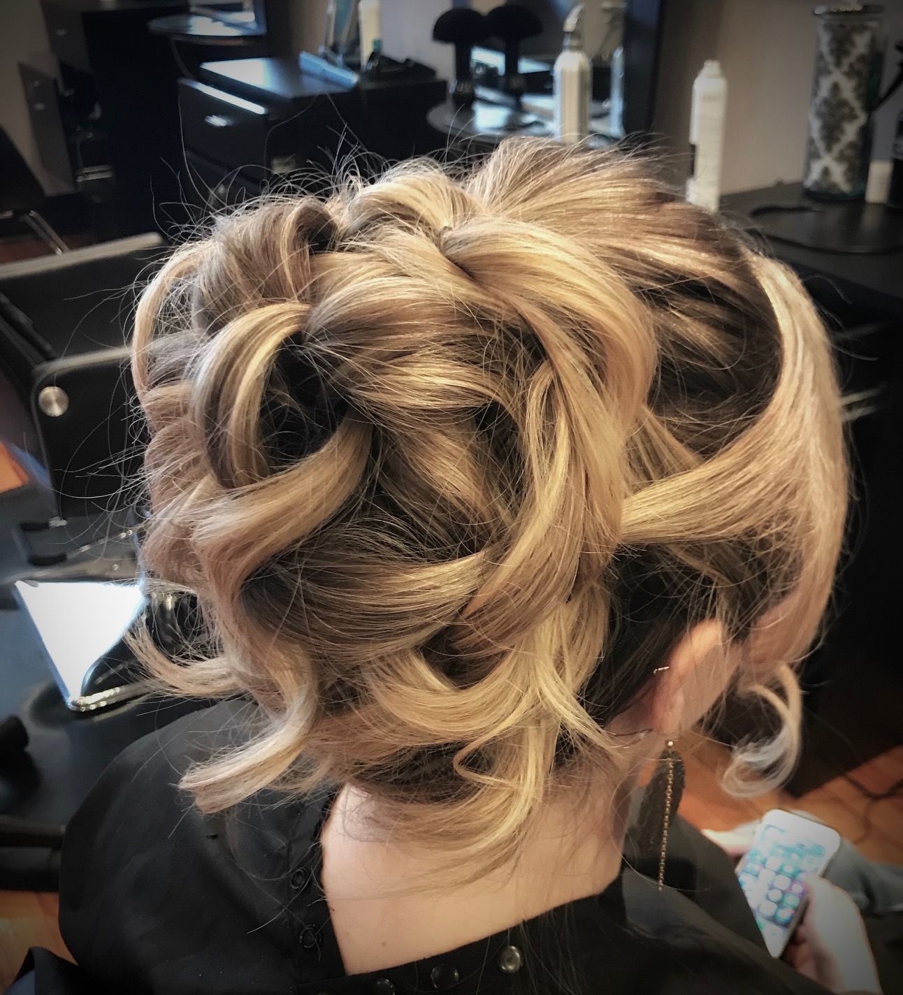 a woman is getting her hair done in a salon