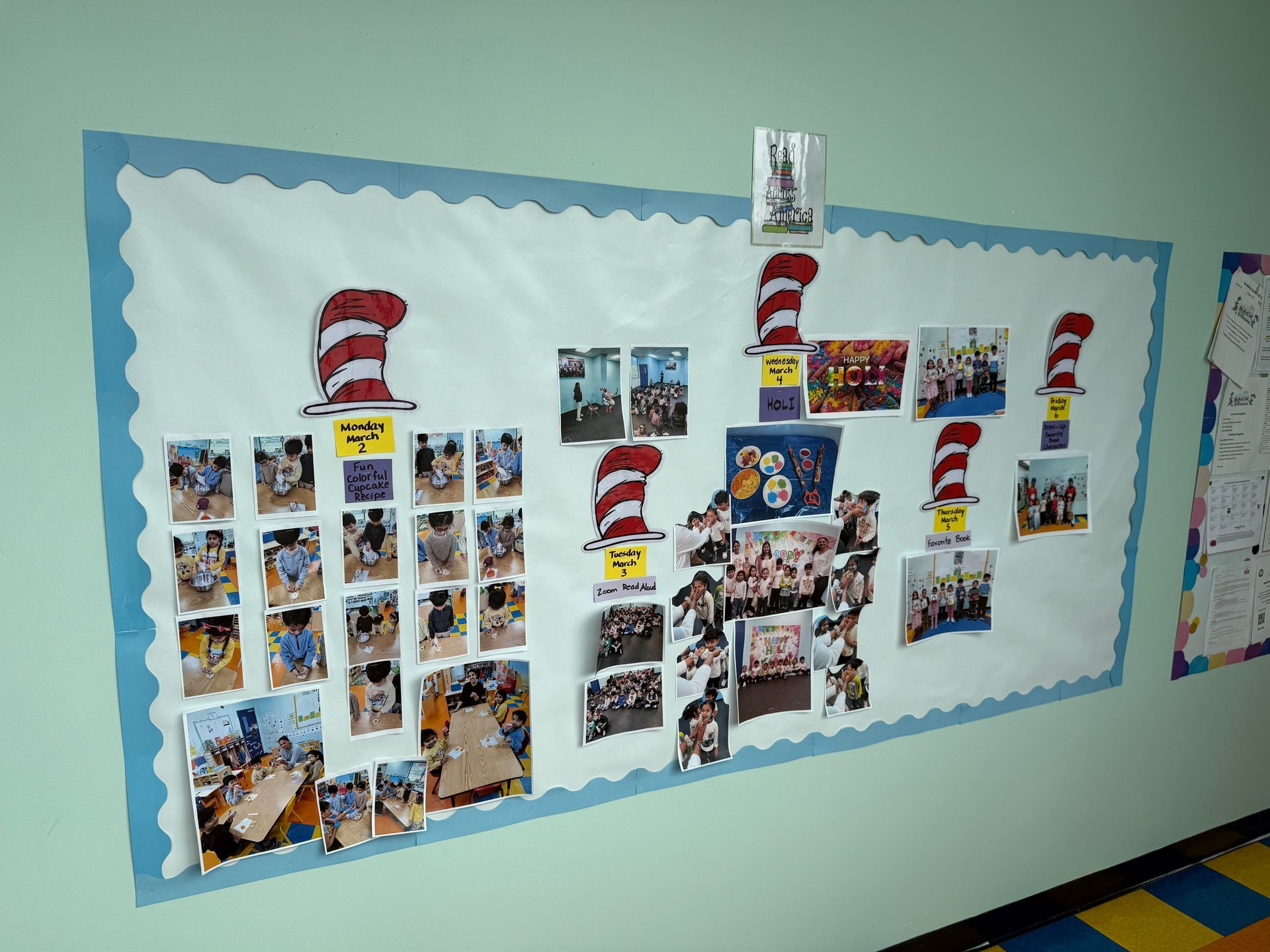 A bulletin board decorated with Dr. Seuss hats displays numerous photos of children participating in classroom activities.