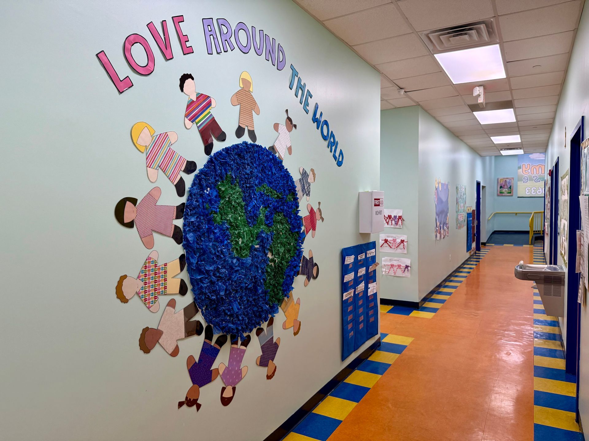 A school hallway mural titled 