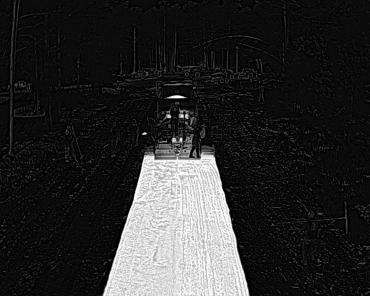 A snowy path leads to a building, with people standing near the entrance.