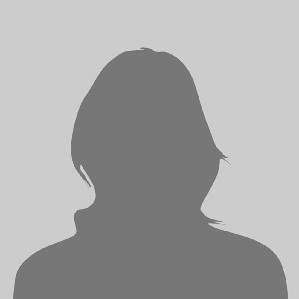 Silhouette of a person with shoulder-length hair, facing forward on a gray background.