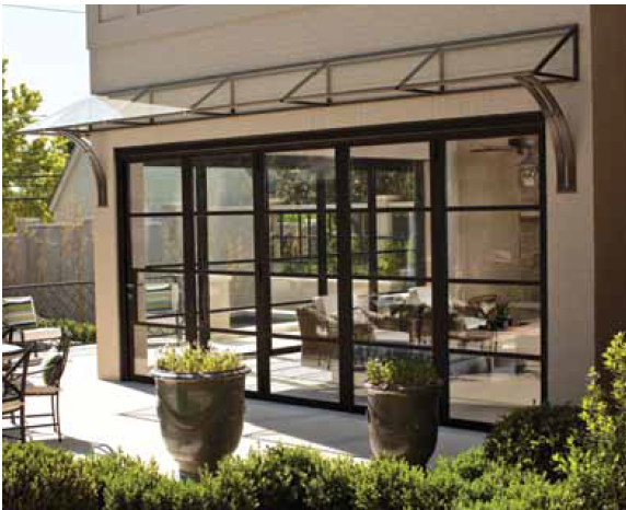 A house with a lot of windows and potted plants