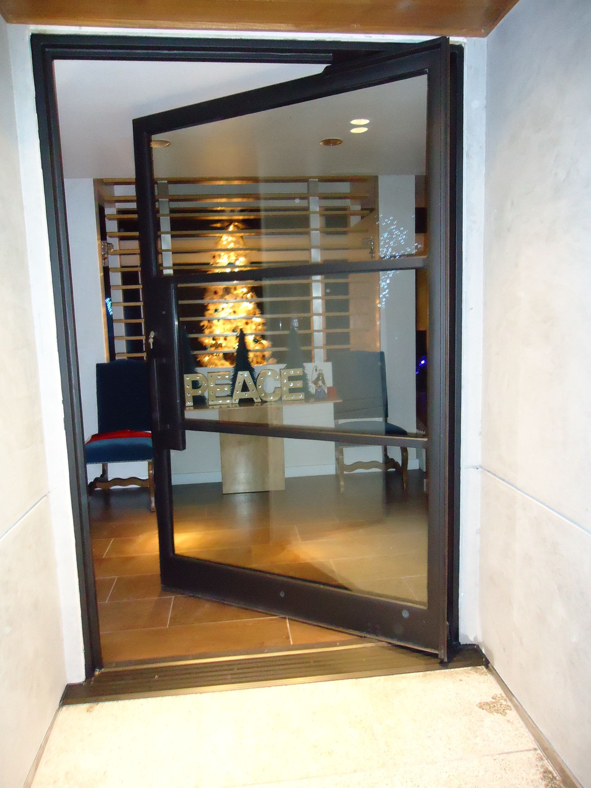 opened pivot glass door