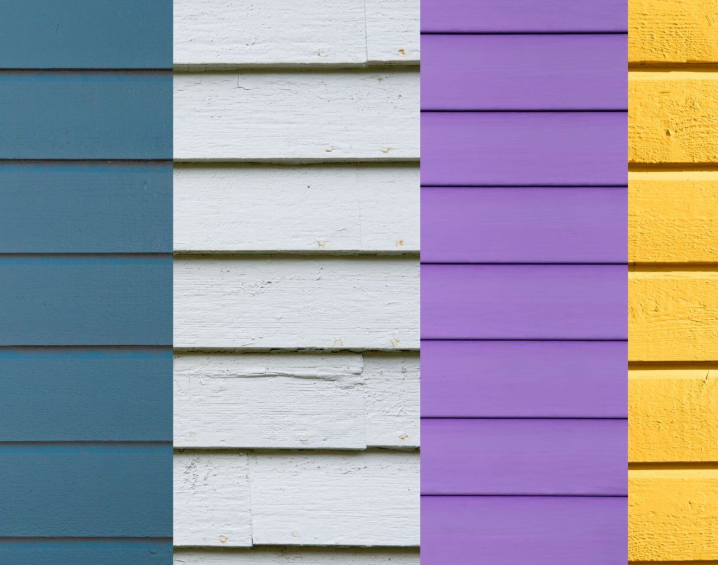 Four vertical stripes of wooden siding in blue, white, purple, and yellow.