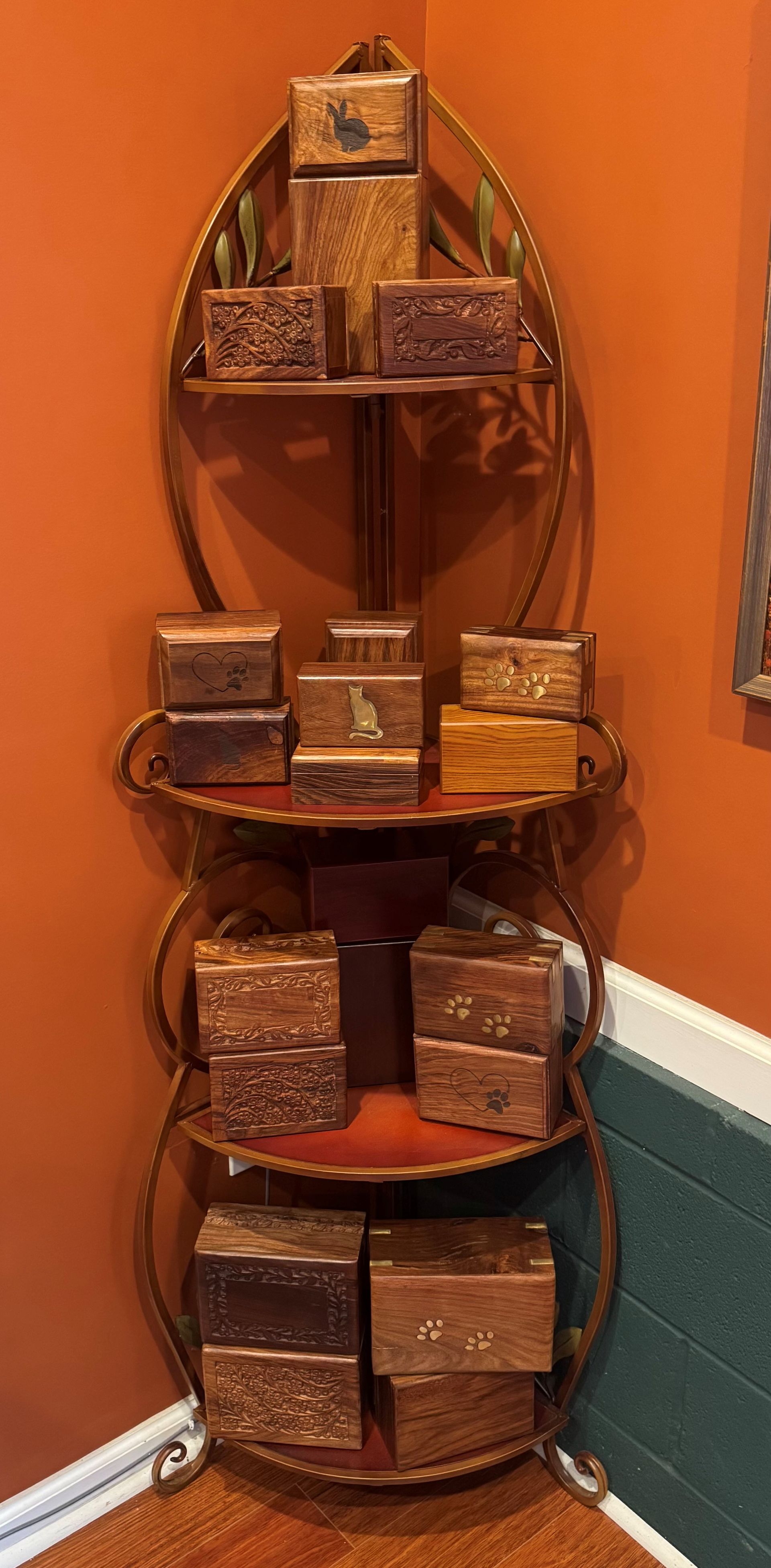Wicker corner shelf with four tiers holding small decorative baskets in a hallway